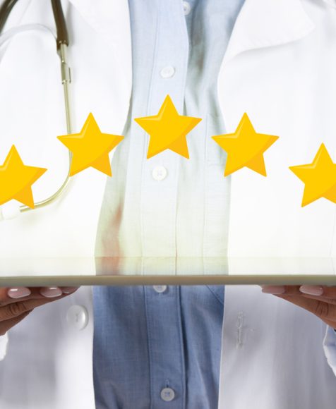 Medical services rating. Unrecognizable young female doctor holding digital tablet with five stars icons above, closeup studio shot, cropped