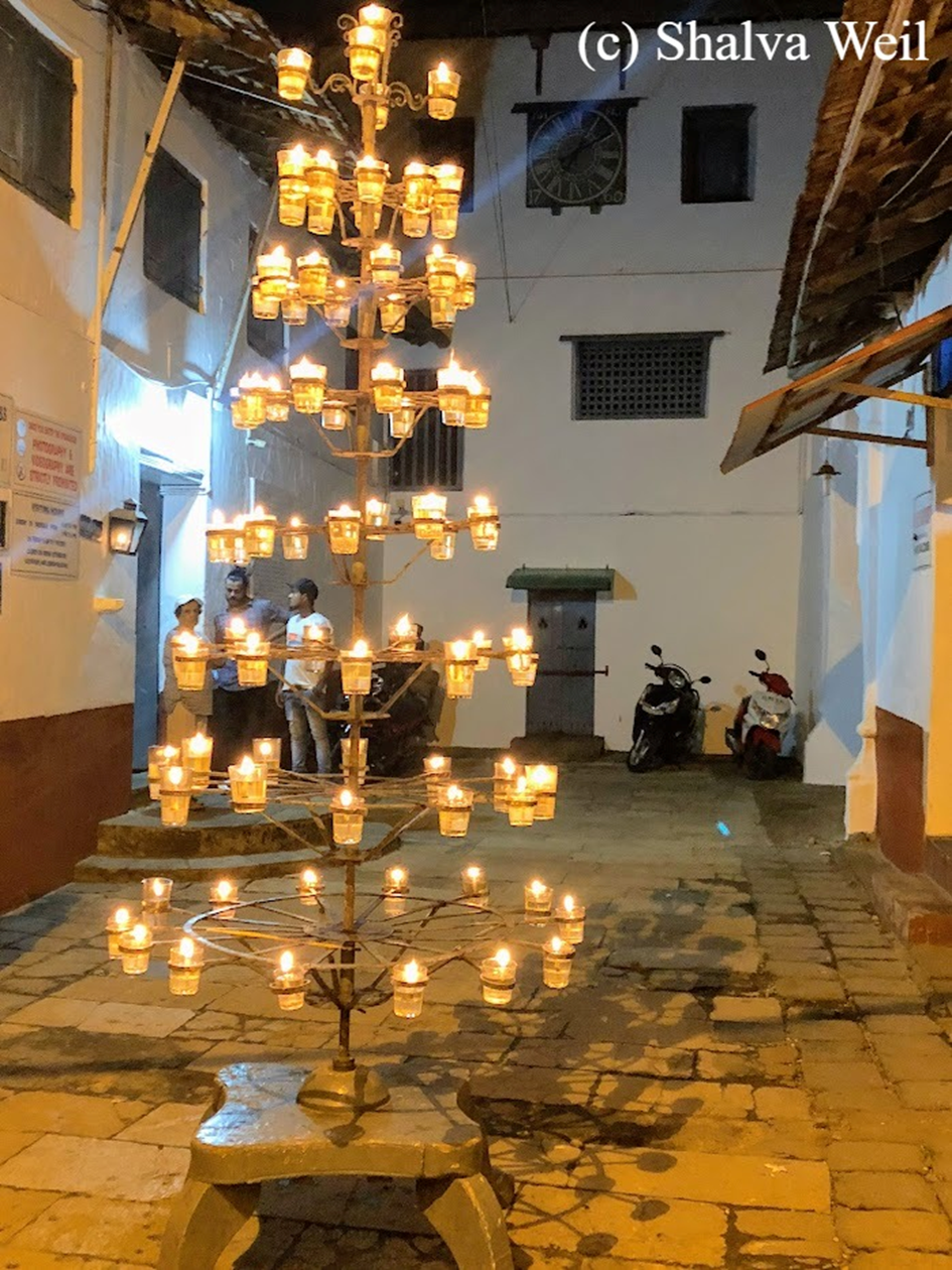 Entrance to the Paradesi synagogue with candelabra lit up